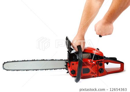 Gasoline chain saw in hand on a white background. 12654363
