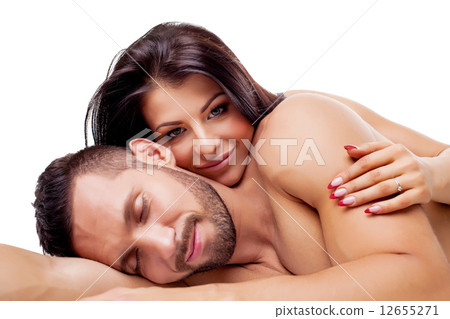 Image of nude lovers smiling dreamily at camera 12655271