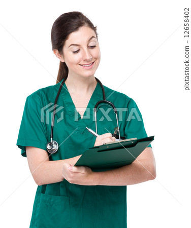 Brunette doctor write on clipboard Brunette doctor write on clipboard 12658402