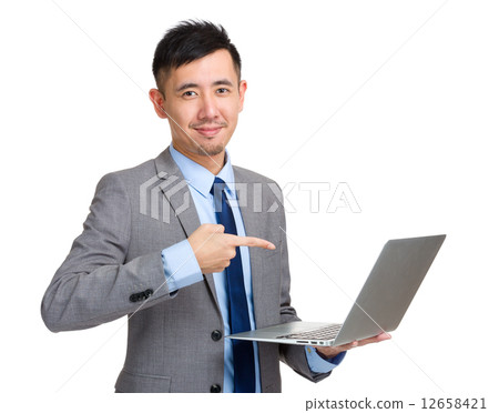 Asian businessman finger point to laptop computer Asian businessman finger point to laptop computer 12658421