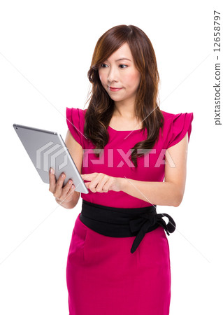 Mature businesswoman use digital tablet Mature businesswoman use digital tablet 12658797