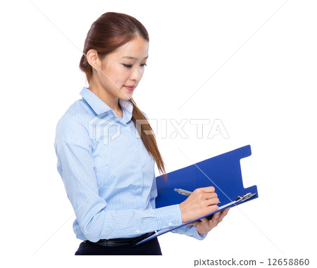 Businesswoman write on clipboard Businesswoman write on clipboard 12658860