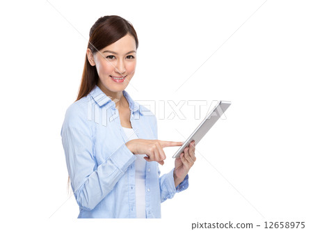 Asian woman touch on digital tablet Asian woman touch on digital tablet 12658975