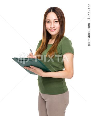 Woman write on clipboard Woman write on clipboard 12659372