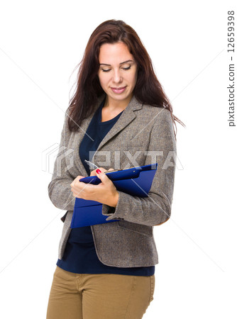 Brunette woman wite on clipboard 12659398