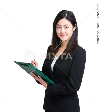 Businesswoman write on clipboard Businesswoman write on clipboard 12659634