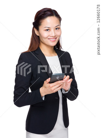 Businesswoman with mobile phone 12660178