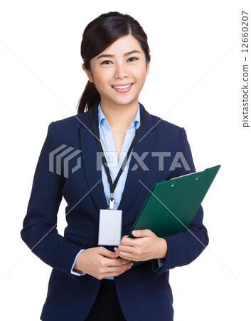 Businesswoman holding clipboard Businesswoman holding clipboard 12660207