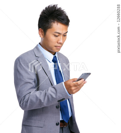 Businessman use mobile phone 12660288