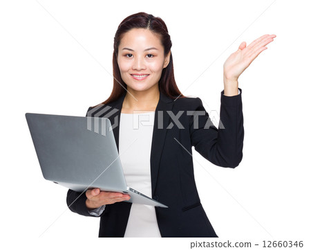 Businesswoman use laptop and hand show something Businesswoman use laptop and hand show something 12660346