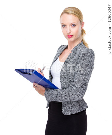 Business woman write on clipboard Business woman write on clipboard 12660347