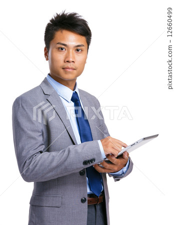 Business man touch on tablet Business man touch on tablet 12660499