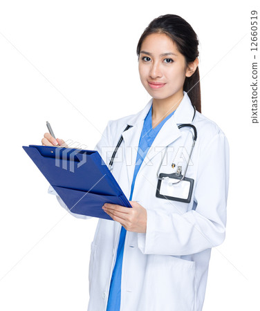 Asian doctor write on clipboard 12660519
