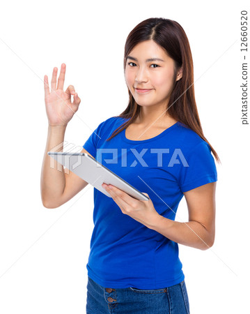 Asian woman with digital tablet and ok sign Asian woman with digital tablet and ok sign 12660520