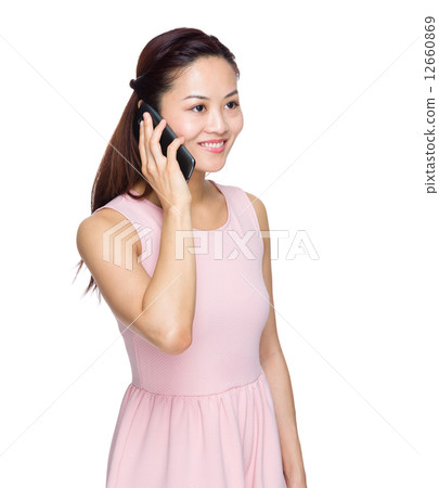 Asian woman talk to mobile phone Asian woman talk to mobile phone 12660869