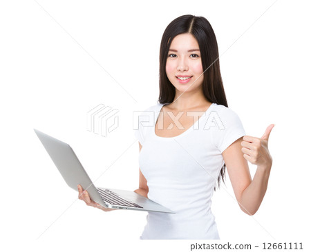 Asian woman use of notebook computer and thumb up Asian woman use of notebook computer and thumb up 12661111