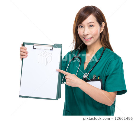 Female doctor finger point to clipboard with white paper Female doctor finger point to clipboard with white paper 12661496