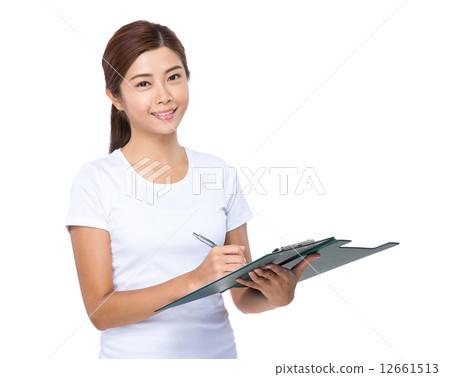 Woman write on clipboard Woman write on clipboard 12661513
