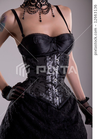 Close-up shot of beautiful young woman in silver corset 12663136