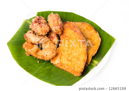 Fried banana and sweet potatoes served on banana leaf Fried banana and sweet potatoes served on banana leaf 12665189
