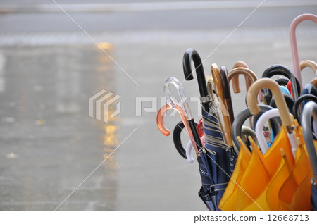 Rain and umbrella 12668713