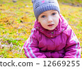 child girl sitting moss thoughtful look fall 12669255