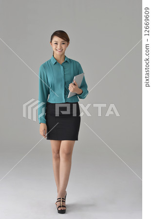 an confident asian office lady with a tablet 12669609