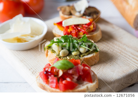 Bruschetta with beans and arugula, mushrooms, goat cheese Bruschetta with beans and arugula, mushrooms, goat cheese 12671056