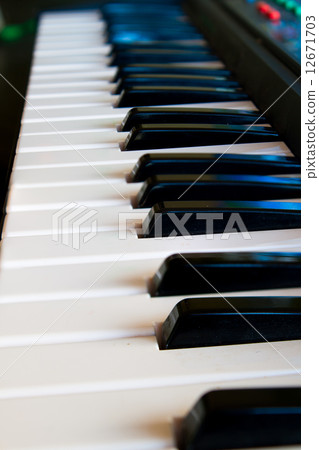 the black and white keys of a piano 12671703