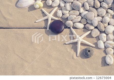 Top view of Starfishs and White Stone on Sand background Top view of Starfishs and White Stone on Sand background 12673004