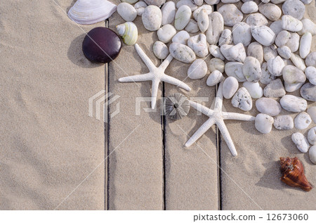 Top view of Starfishs and White Stone on Sand background Top view of Starfishs and White Stone on Sand background 12673060