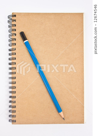 Blue pencil on brown notebook's cover. 12674546