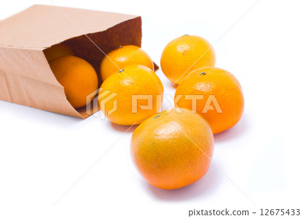 Six oranges falling from paper bag, isolated on white background 12675433