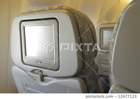 LCD screen in airplane seat LCD screen in airplane seat 12677128