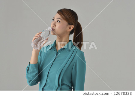 Asian Lady drinking bottle water 12678328