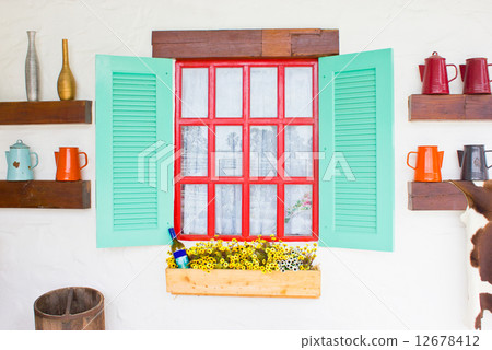 Colorful window with decorating stuffs. 12678412