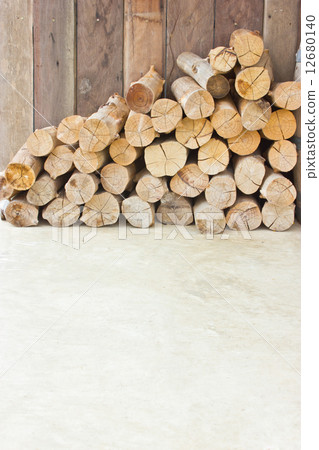 Pile of dry firewood on the ground with copy space. Pile of dry firewood on the ground with copy space. 12680140