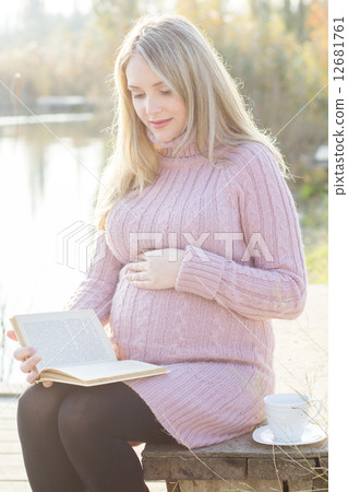 Pregnant woman on the autumn lake Pregnant woman on the autumn lake 12681761
