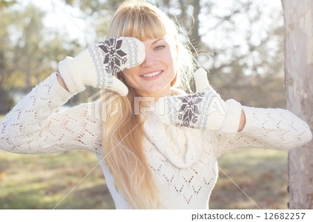 Attractive blonde girl with wearing warm clothes Attractive blonde girl with wearing warm clothes 12682257
