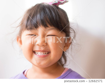 A smiling girl A smiling girl 12682571