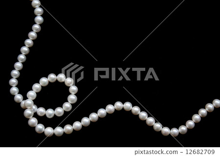 White pearls on the black velvet 12682709