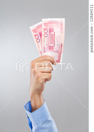 Businessman hand hold hundred chinese renminbi 12684511