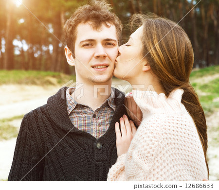 young couple in love outdoors on a sunny day young couple in love outdoors on a sunny day 12686633