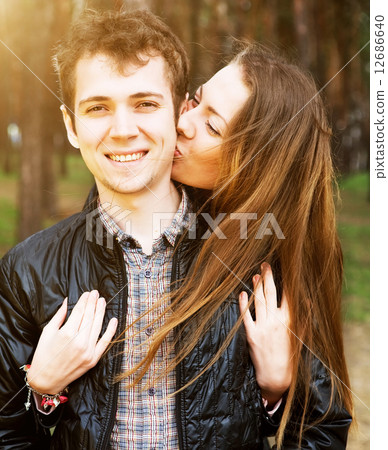 young couple in love outdoors on a sunny day young couple in love outdoors on a sunny day 12686640