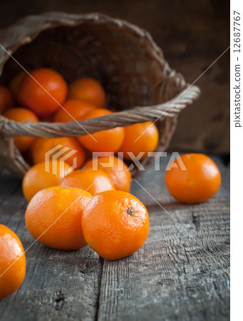 Basket and Tangerines on Wooden Background Basket and Tangerines on Wooden Background 12687767