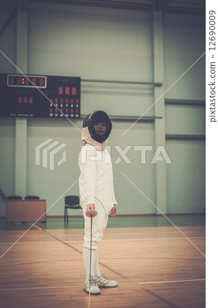 Little girl fencer with epee and mask 12690009