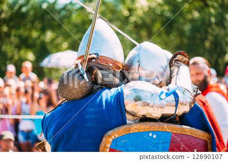 Knights In Fight With Sword. Restoration Of Knightly Battle 12690107