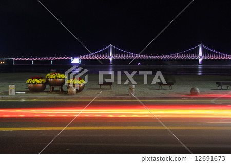 Colorful Gwangan bridge with busy traffic on foreground, Busan, Korea 12691673