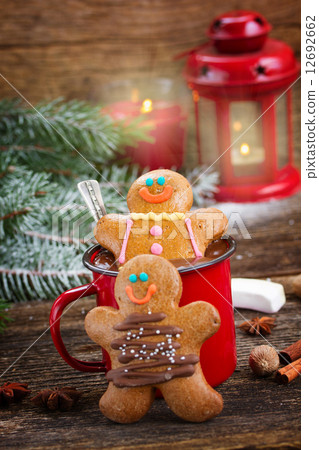 Gingerbread men with mug of hot chocolate 12692662