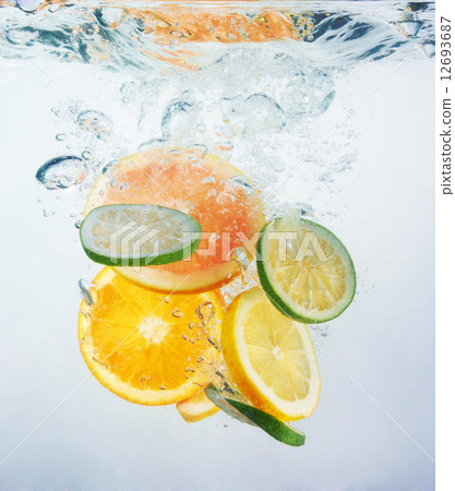 Fresh orange dropped into water 12693687